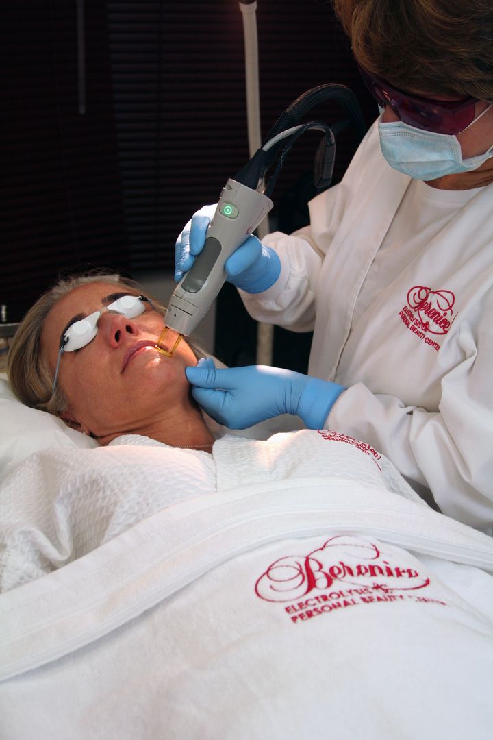 A laser hair removal treatment at the practice, the client in protective eyewear